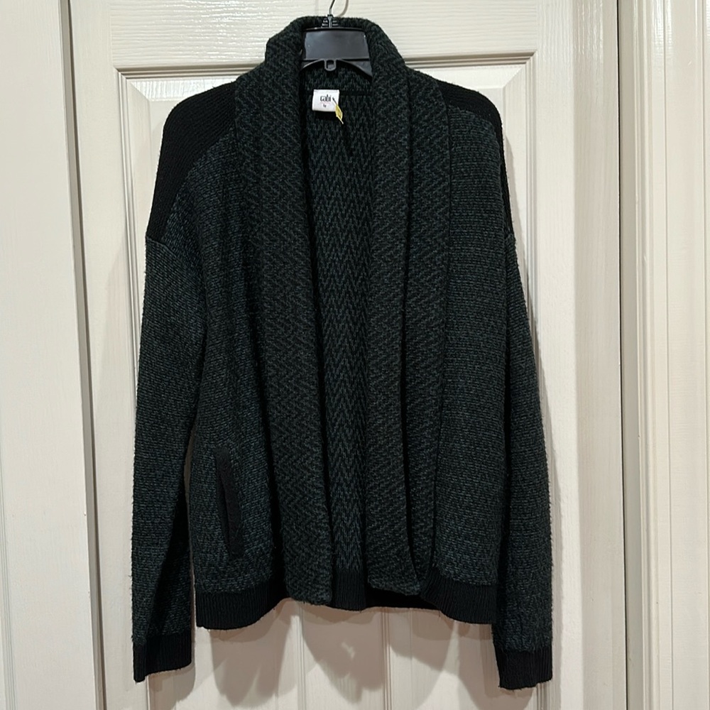Shawl sweater in teal and black herringbone with pockets and shoulder detail.